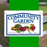 Picture of Marcia Johnson cutting tin, the Community Garden sign, and the garden beds.