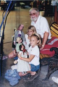 Children holding puppets