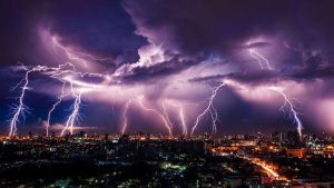 a very powerful lightning storm lighting up the sky