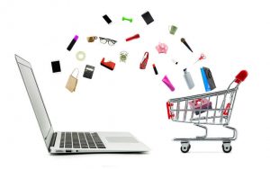Products flying from a computer screen into a shopping kart